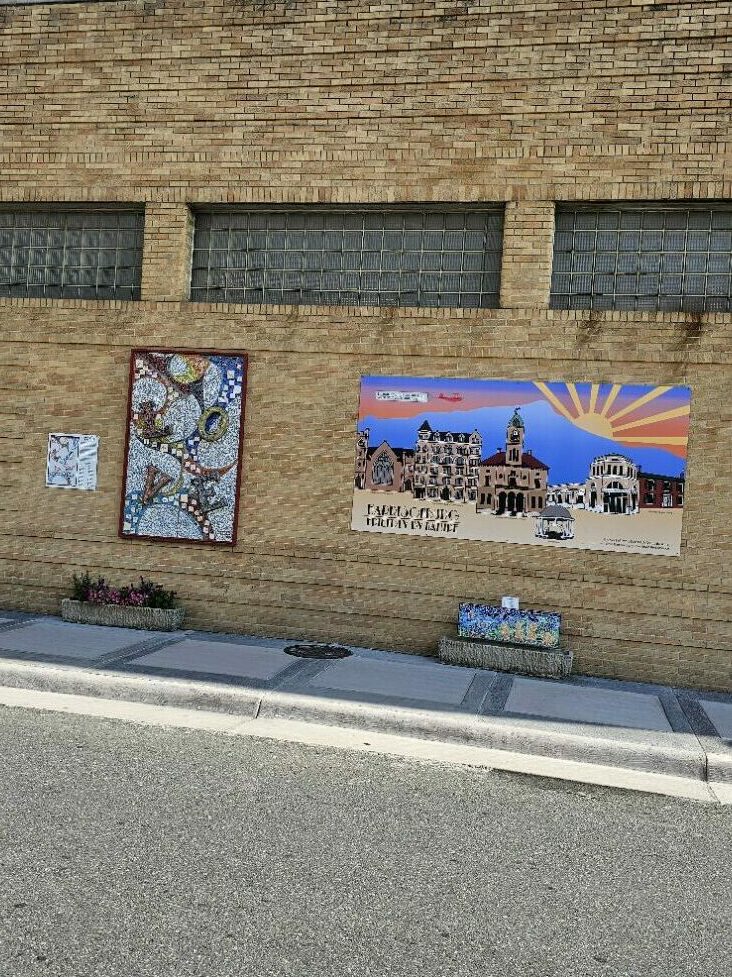 Mural art panels on side of Oasis building in Harrisonburg.