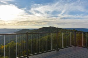 View of mountains from a deck.